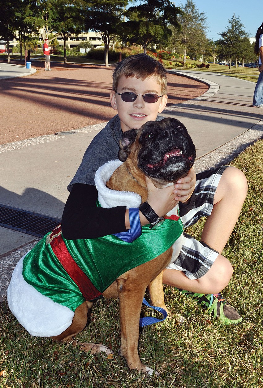 Achieva held its second Reindeer Trot 5K and 10K, Dec. 1, at Payne Park, to benefit Sarasota County classrooms. Ryan Mandia, 11, attended with his dog, Bandit.