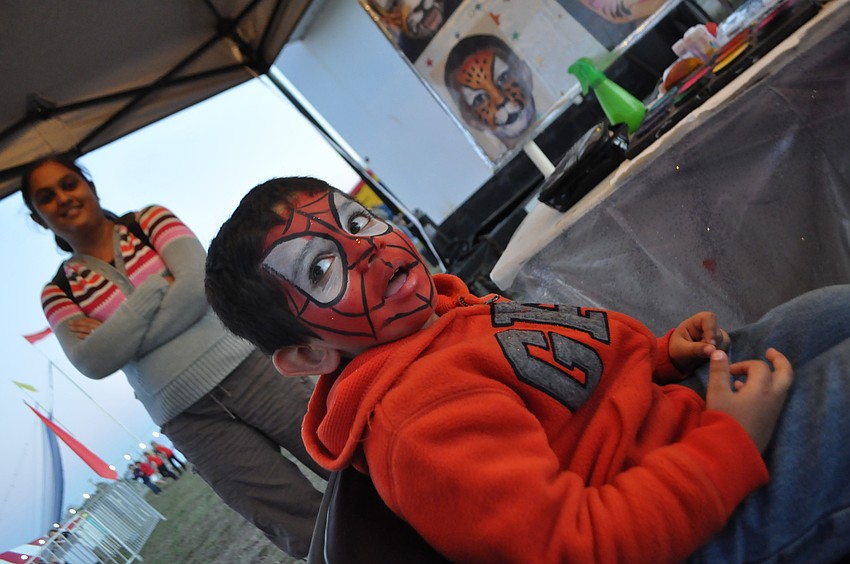 Ayaan Patel, 3, gets his face painted.