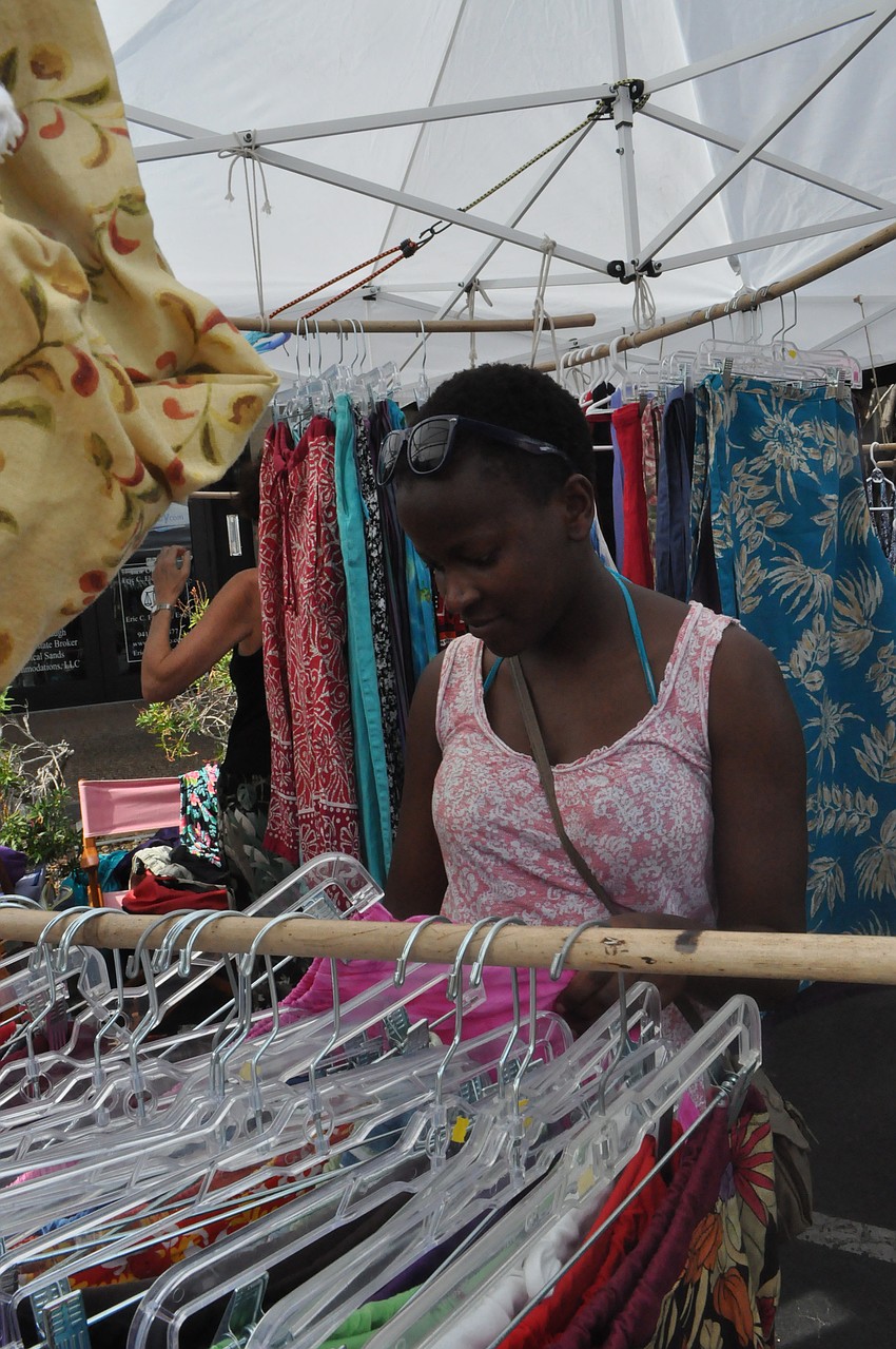 Nami Kisaalita looks through Up â€“ Cycled Fashions dresses.