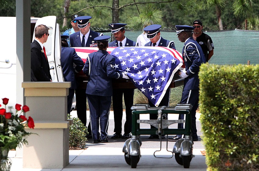 Pallbearers lifted Longboat Key Police Chief Albert Holeâ€™s casket at May 24 at the Sarasota National Cemetery.