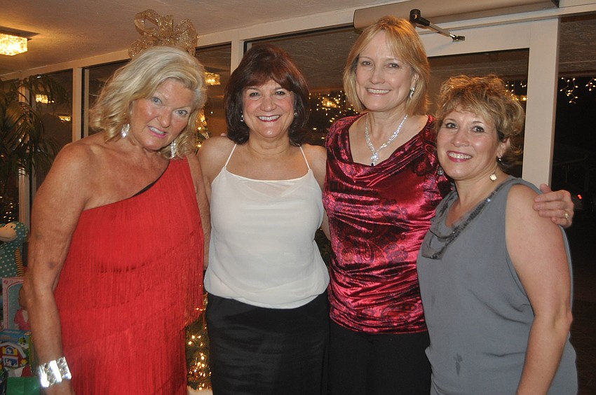 Heidi Lagro (far left) hosted 100 guests, including Judy Johnson, Diane Doolittle and Lisa Margolies, at her Arbomar home Dec. 6 for Christkindl, a German-themed Christmas party to benefit Toys for Tots.