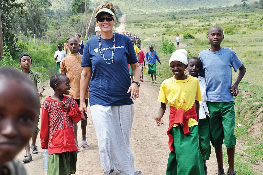 Beth Barnett takes a nature walk with the children of Fiwagoh Orphanage in Narkuru, Kenya. Published Aug. 23, 2012.
