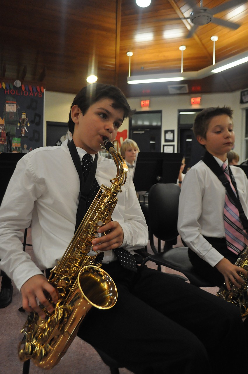 Connor Cintron plays the saxaphone.