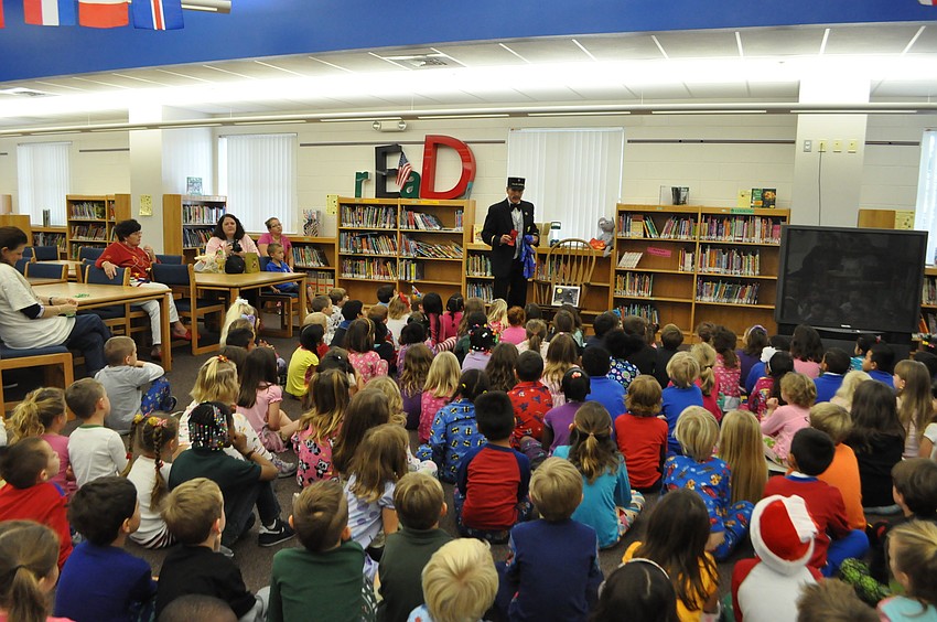 Seven kindergarten classes listened to Patrick Sanders tell the story of the Polar Express.