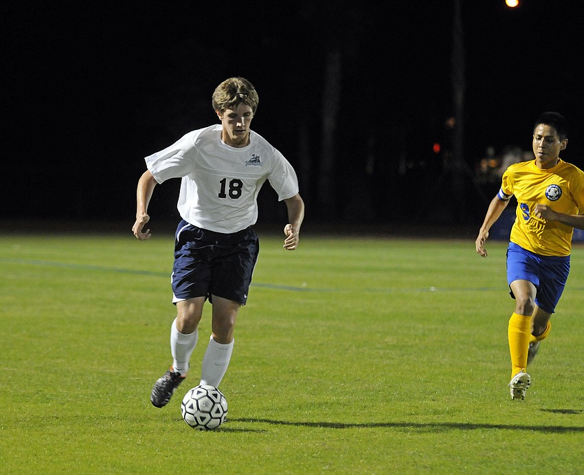 ODA sophomore Matthew Leonard brings the ball up the field in the first half.