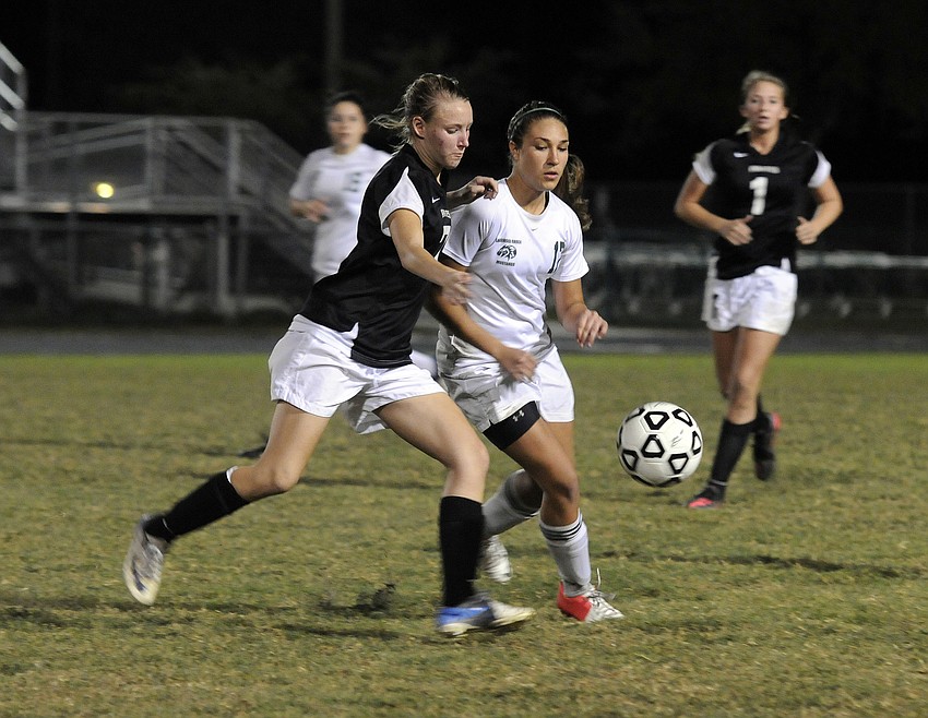 Braden Riverâ€™s Kyrstin Baily and Lakewood Ranchâ€™s Hannah Miller race to the ball in the second half.