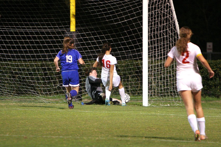 Gatewayâ€™s Jessica McGowan, No. 19, tries to stop Cardinal Mooneyâ€™s Rose Amato, No. 16, from scoring Wednesday, Jan. 16. Amato got past the goalie and did score the second goal of the game for Cardinal Mooney.