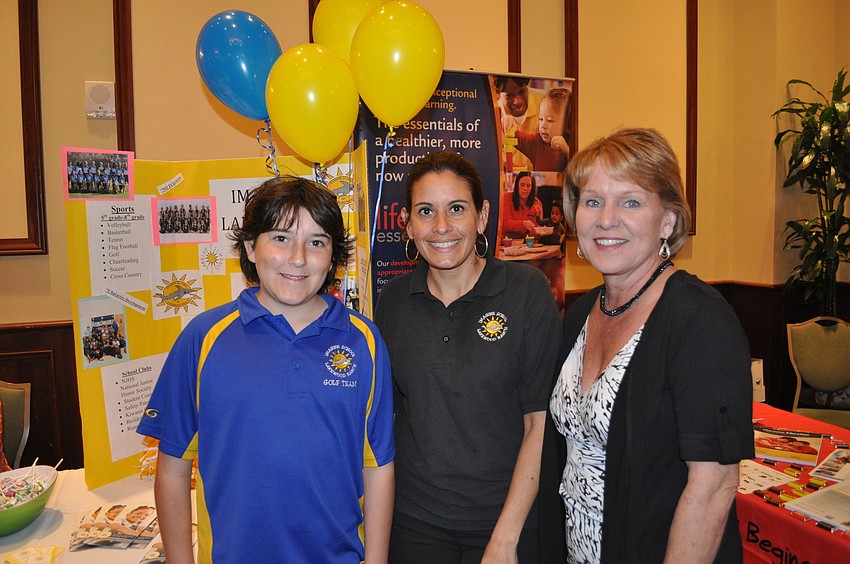 Tyler Zampino of the Imagine Lakewood Ranch golf team with Selenia Quinones, a school leader and Diane Tisone of the schoolâ€™s registrar