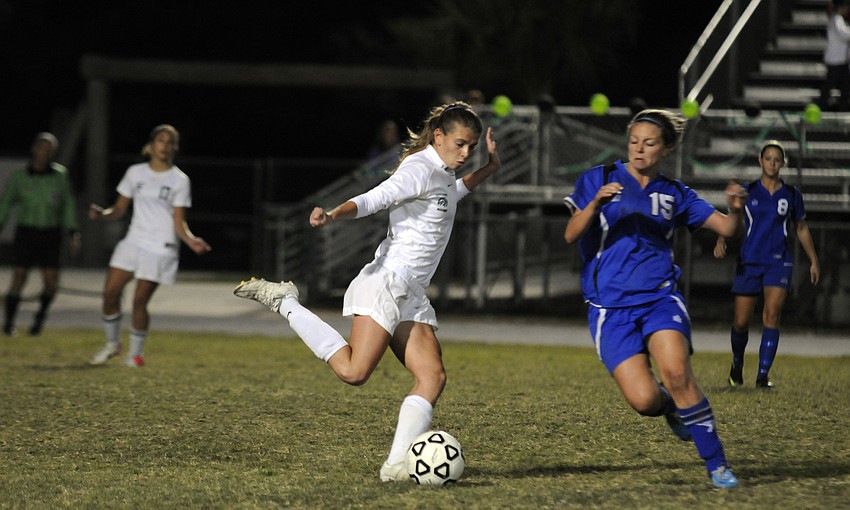 Lakewood Ranchâ€™s Tyler Gordon sends the ball up the field to an open teammate.