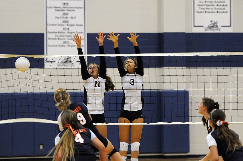 Monica Costa and Gabriella Costa go up for a block.