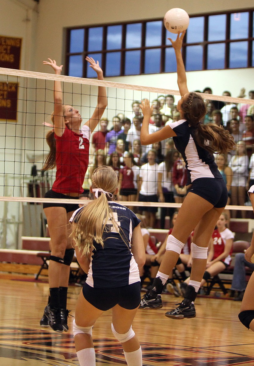 Cardinal Mooneyâ€™s Gabby Schweigart, No. 2, prepares to block the Out-of-Door Academyâ€™s Gabriella Costaâ€™s, No. 3, shot as teammate Natalie Buffett, No. 4, stays close, Thursday, Sept. 20 at Cardinal Mooney.