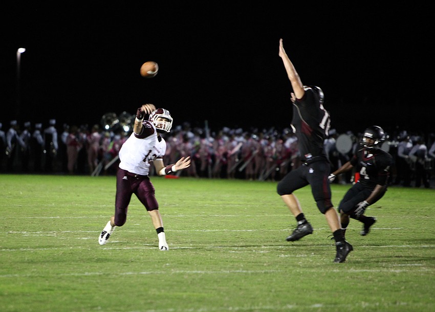 Dominic Marino, No. 12, throws the ball to a teammate.
