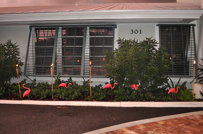 Flamingos and tiki torches decorated the outside of Bird Key Yacht Club Saturday, Sept. 22 during the luau party.