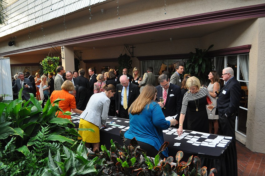 Guests file in at the start of the event.