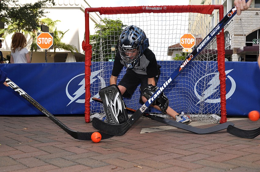 Anthony Gromin, 10, got to put on some goalie gear and attempted to stop multiple shots at once Saturday, Sept. 29.
