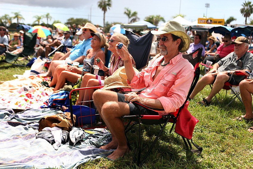 Terry Hughes shakes his egg shaker along with one of Paul Thornâ€™s songs Saturday, Sept. 29 at the 22nd annual Sarasota Blues Festival.