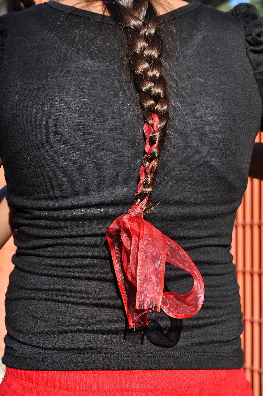 Anisabel Alonzo, 4th grade, wore a red ribbon in her braid and black and red for Lady Bug Day Thursday, Oct. 4, at Gulf Gate Elementary.
