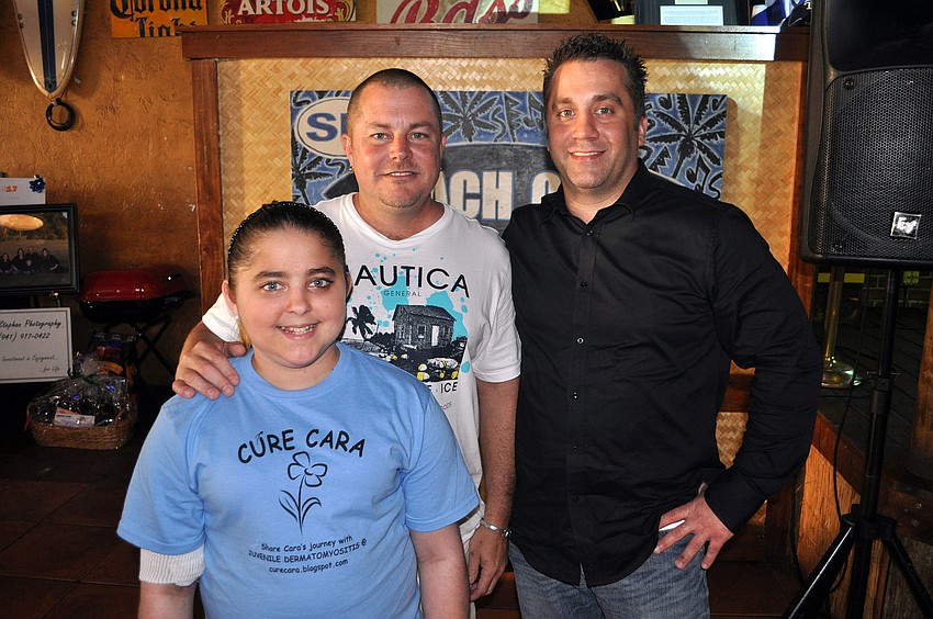 Scott Bodziak, Cara Bodziak and emcee Eddie Stoebe