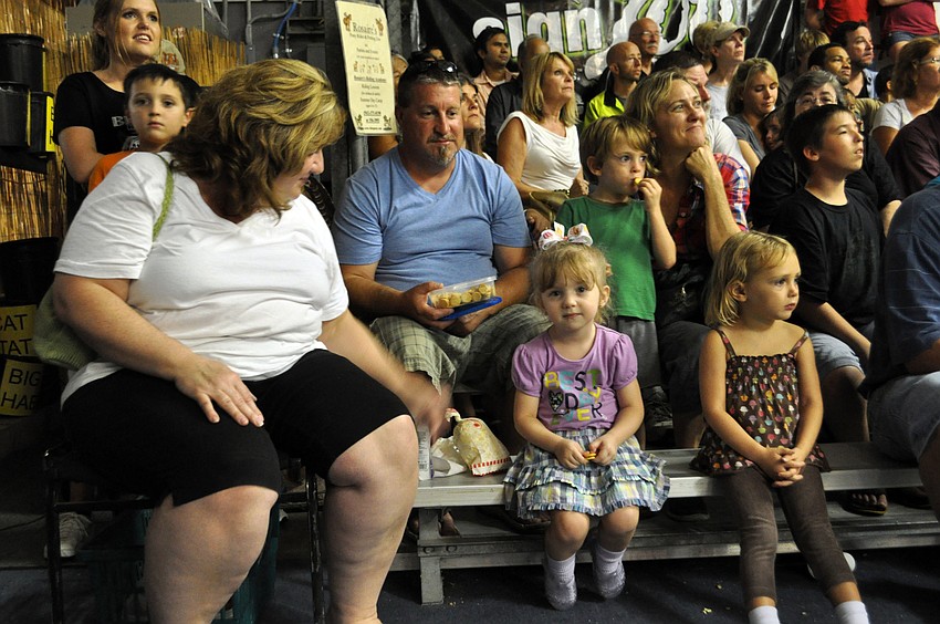 Denise Falvey sits with her 4-year-old daughter, Brooklynn, who celebrated her birthday at the event.