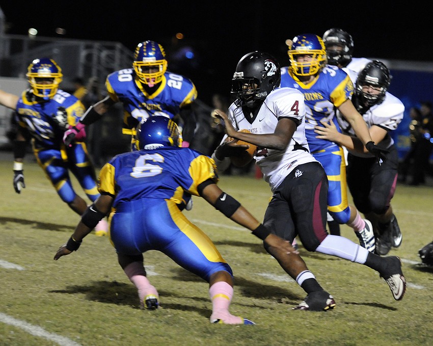 Braden River freshman Breyon Pittman looks to break past a Bruins defender.