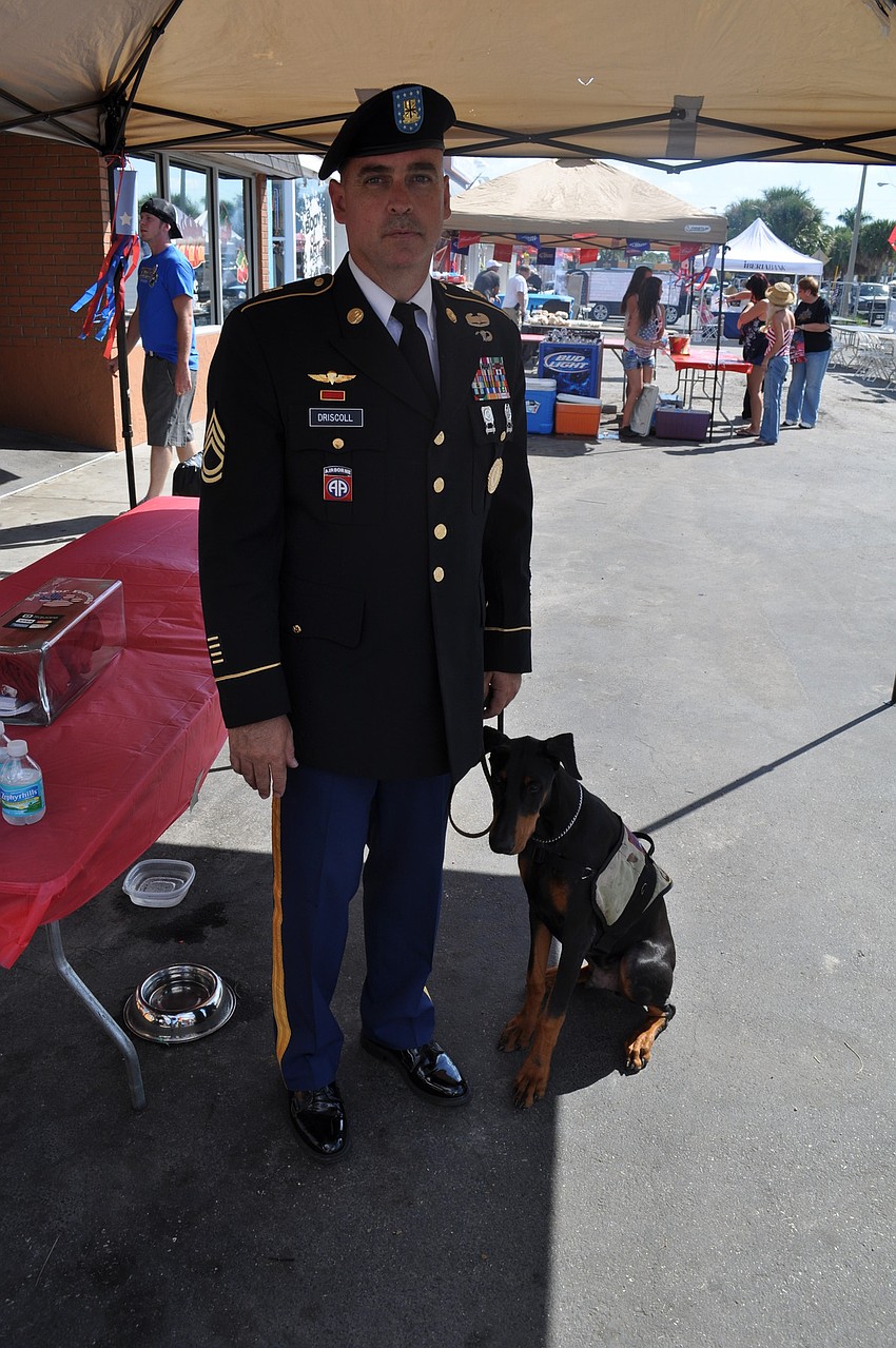 Anthony Driscoll with Onyx, a service dog in training.