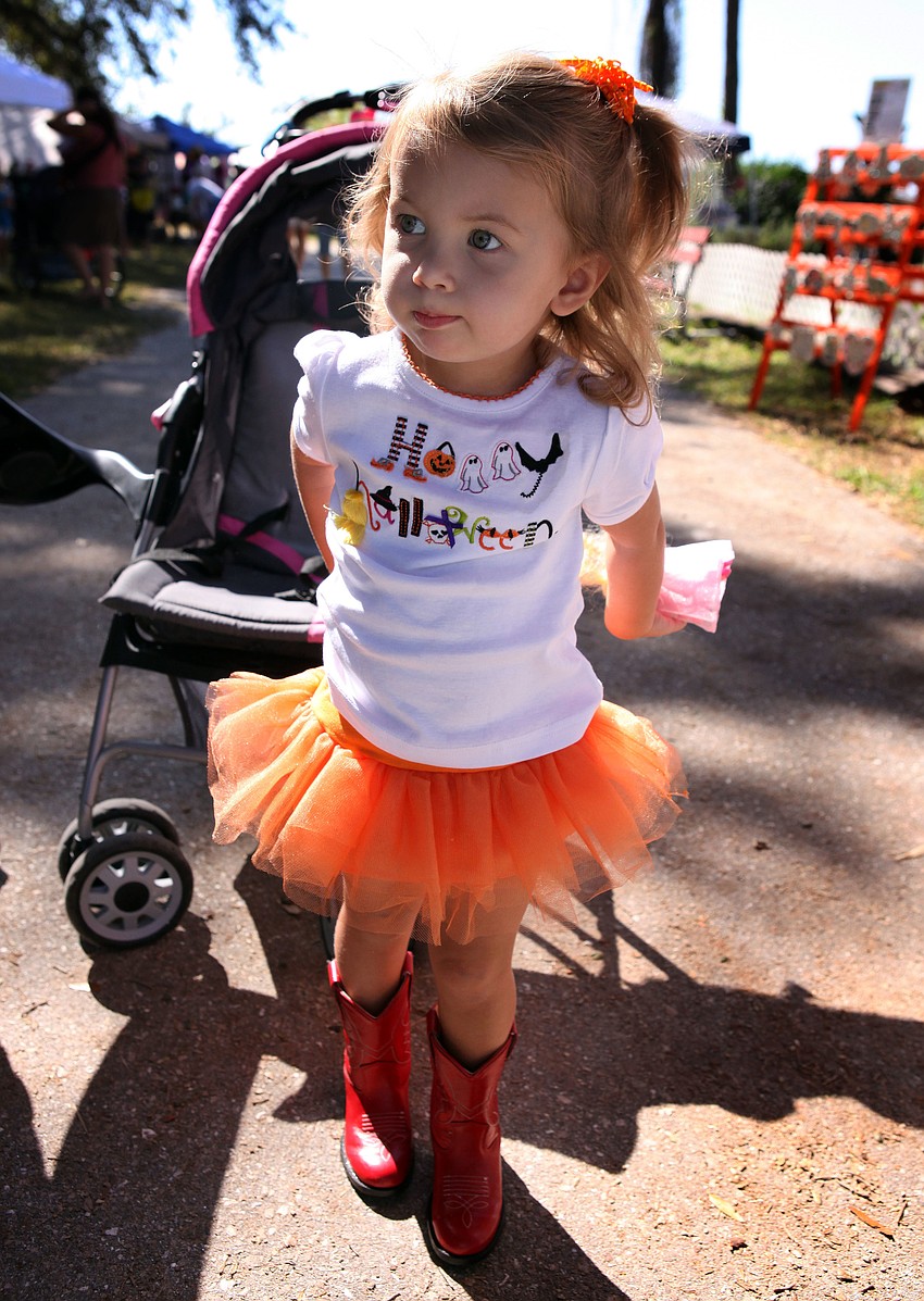 Samantha Chessler, 2, wore a Halloween shirt, an orange tutu and red cowboy boots to the pumpkin festival Saturday, Oct. 20.