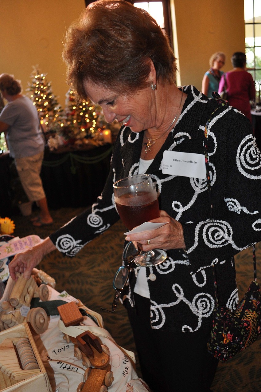 Ellen Buccellato checked out wood items from Muse Galleria for her grandchildren.