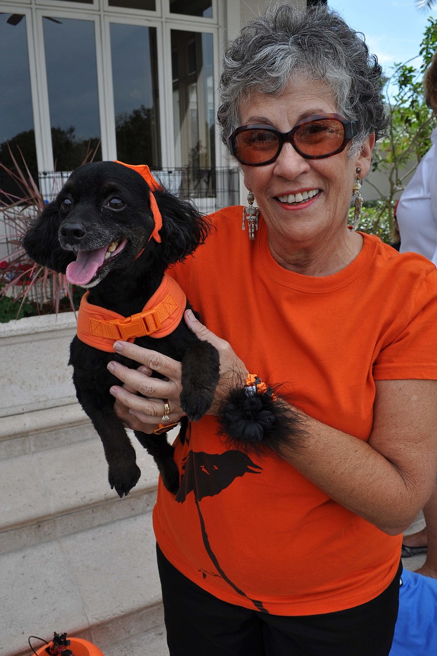 Gracie dressed like her owner, Debby Kehoe.