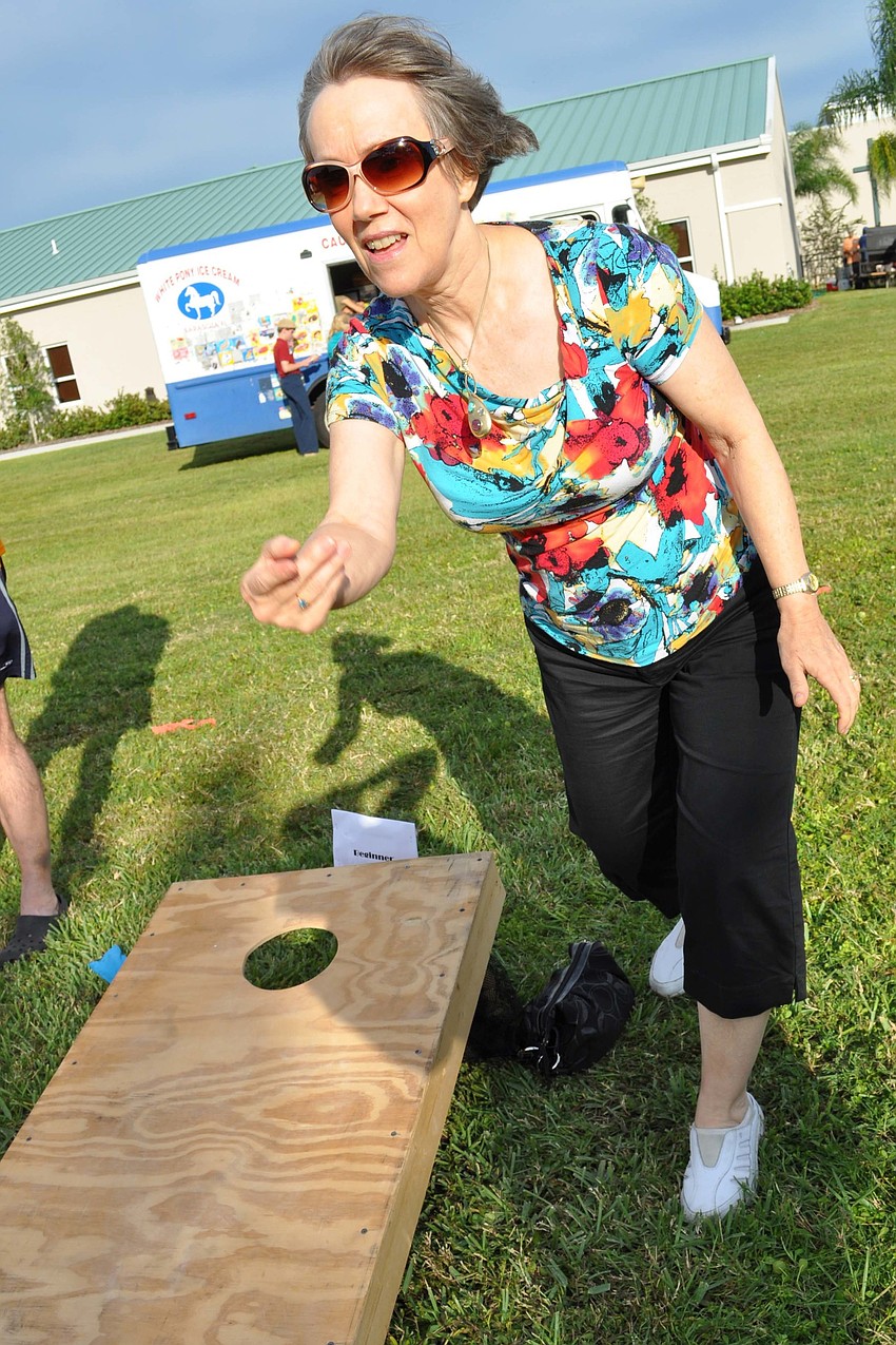Sharon Bateman played a game of corn hole with her husband, Keith, not pictured.
