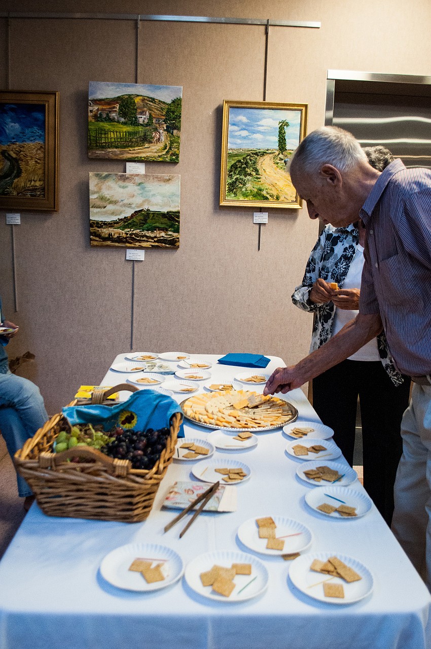 Irv Brott enjoys refreshments at the Federal Building.