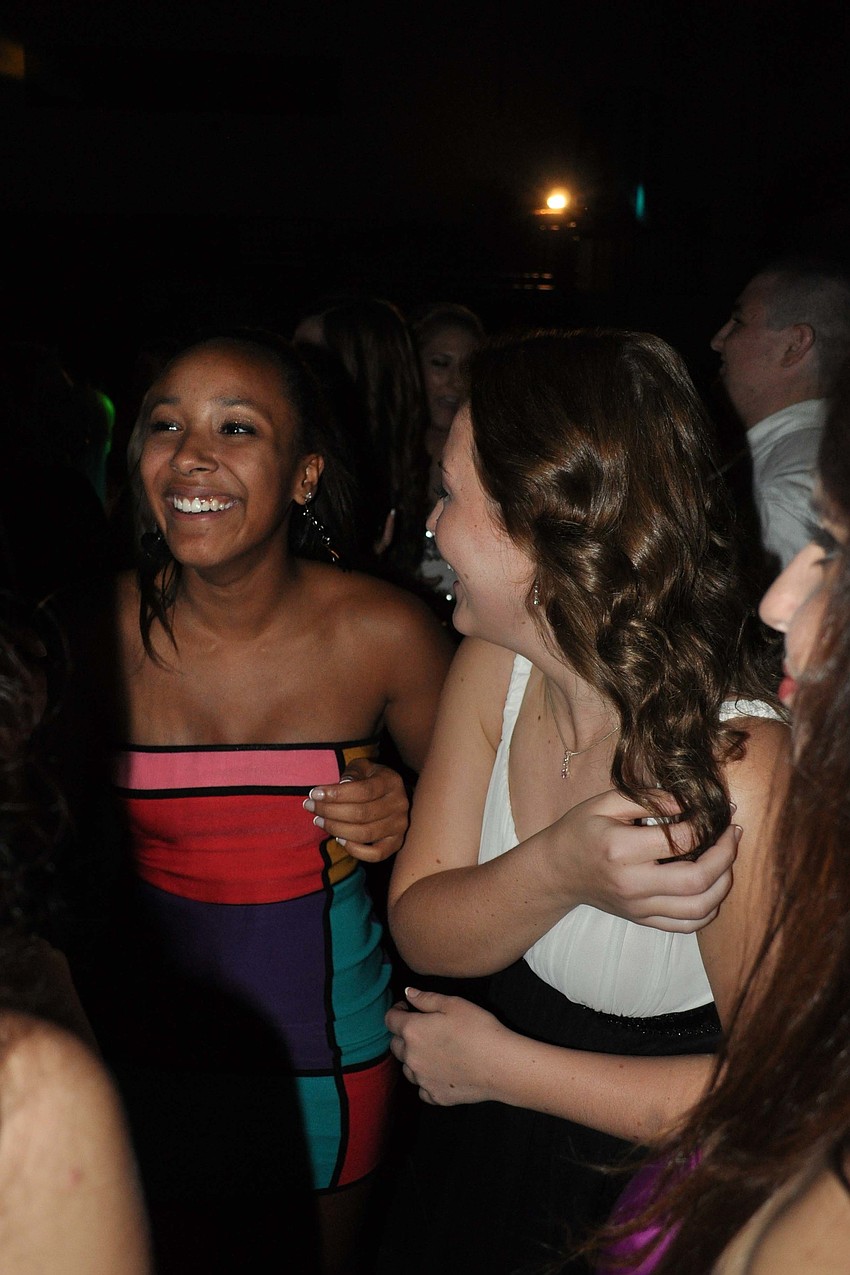 Alicia Harris, left, danced the night away with friends at the Homecoming Dance Oct. 27.