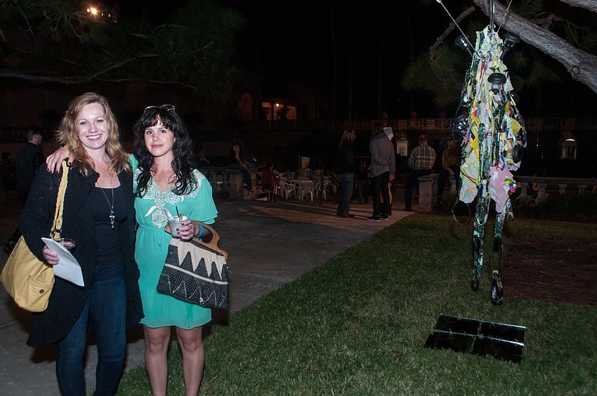 Jenean Derheim stands with her daughter Kasey Lindley, the artist of the In the Home of ____ next to her work.