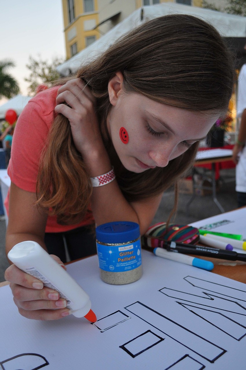 Tessa Miller, 15, made final touches to a sign.