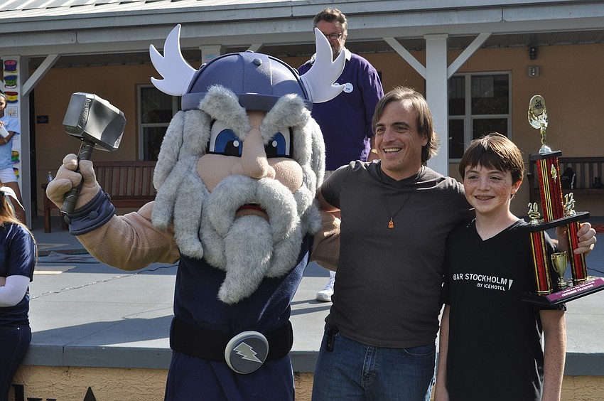 ODAâ€™s mascot posed with Fred Romano and his son, Matteo, who won the chili cook off.