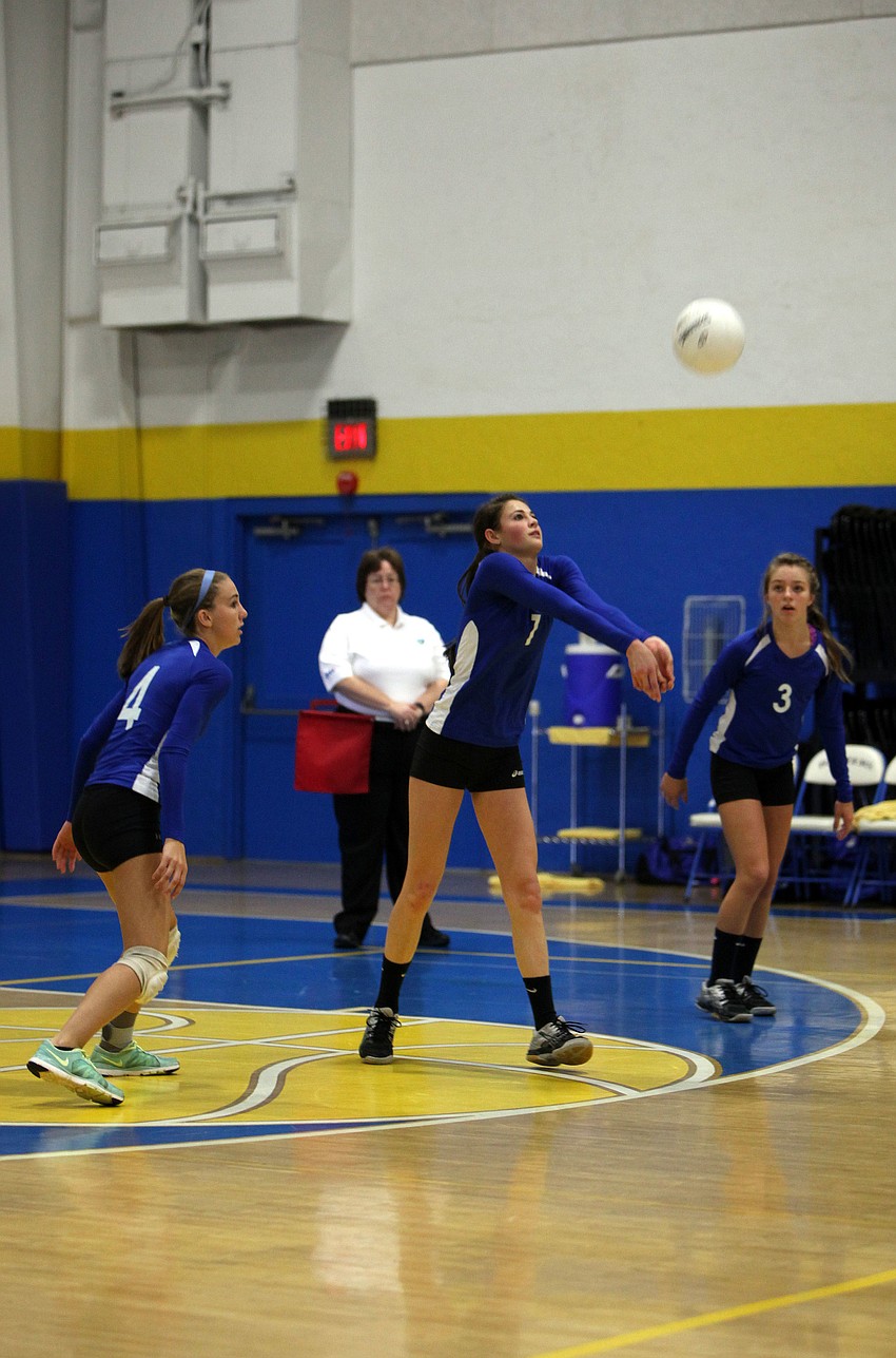 Nicole Wittmer, No. 1, bumps the ball.