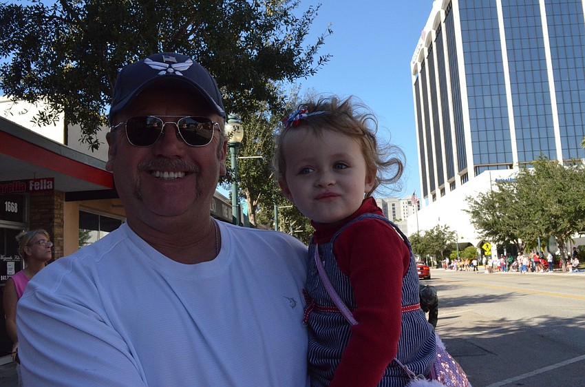 Greg Young holds Layla Frank.