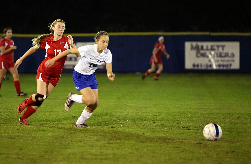Sarasota Christianâ€™s Emma Kral, No. 10, and Cardinal Mooneyâ€™s Emily Brown, No. 17, both hustle after the ball Monday, Nov. 26, at Sarasota Christian.