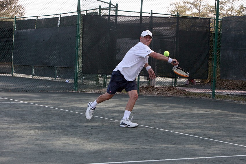 Bob D. Boldmon reaches out to hit a backhand.