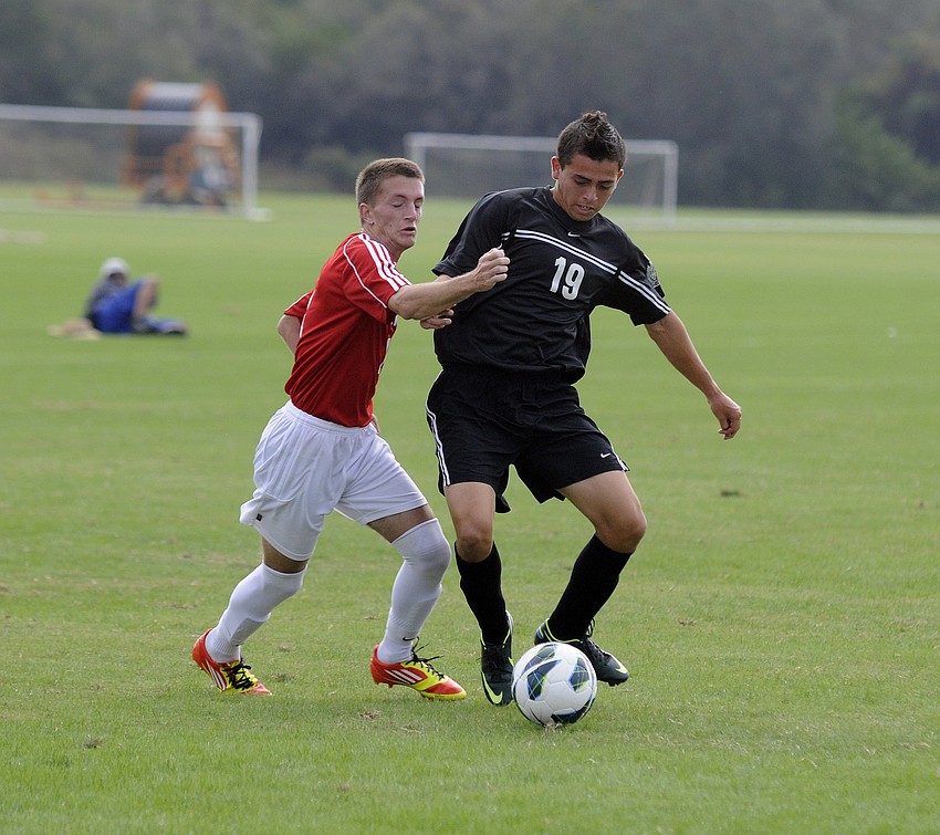 Braden Riverâ€™s Juan Ojeda maneuvers past a Clearwater midfielder.