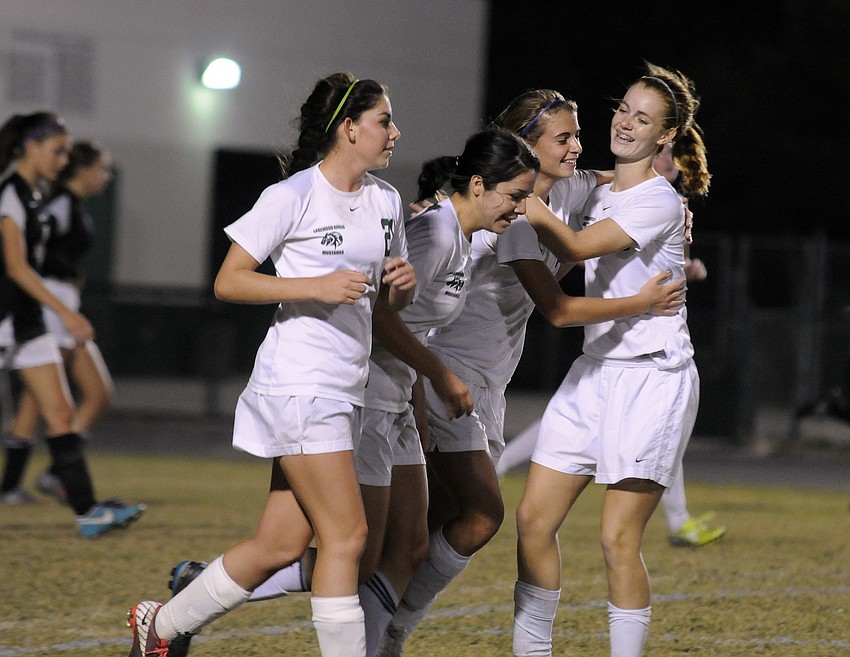 Lakewood Ranchâ€™s Angelica Rego, Lindsay Martinez, Tyler Gordon and Megan Hardy celebrate Gordonâ€™s goal in the second half.