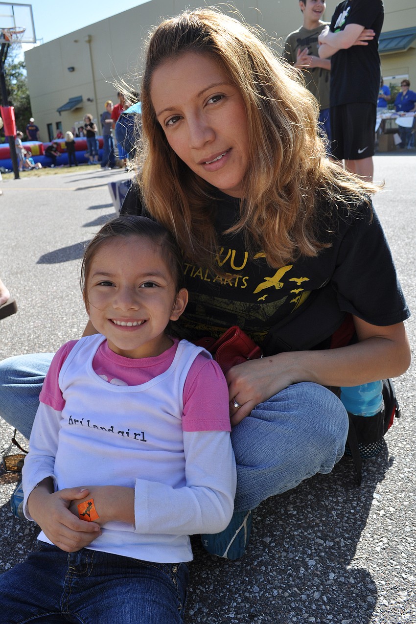 Meranda Lezama, 5, watched a martial arts demonstration with her mother, Alicia Castro.