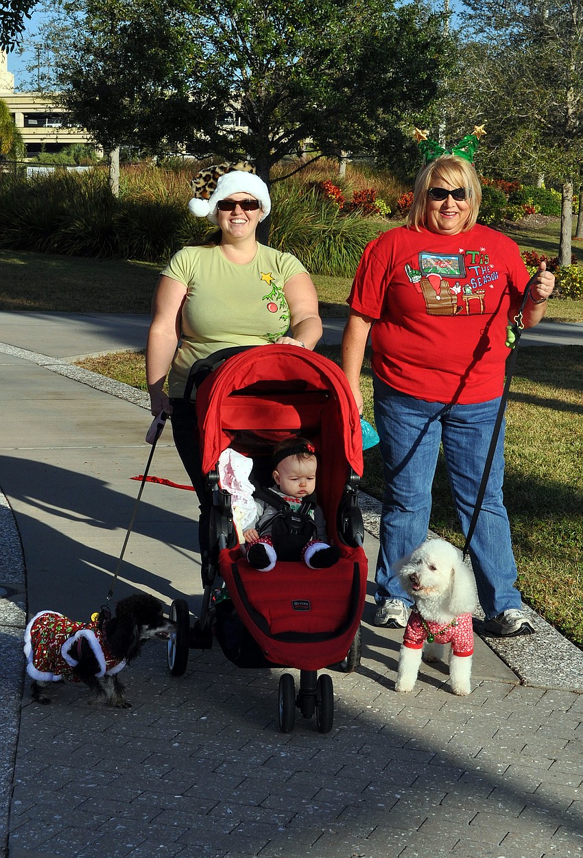 Michala Chipurnoi with her daughter, Gabriella, 9 mos., and Jeanette Schwaed with their dogs Mitzi, 1 Â½, and Colt, 6.
