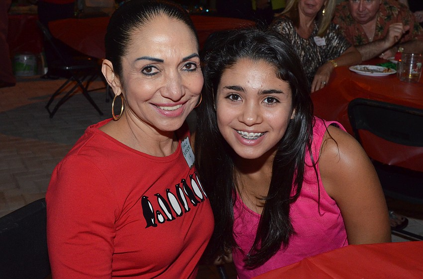 Maria Buerger enjoys the party with her granddaughter Stephanie Valdes.