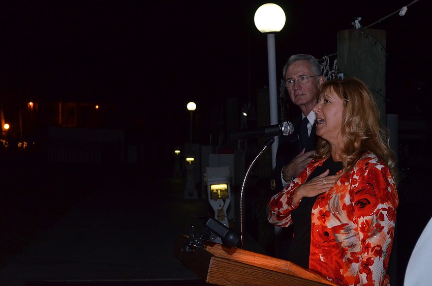 Susan Pinzino sings the national anthem during the Blessing of the Fleet Ceremony.