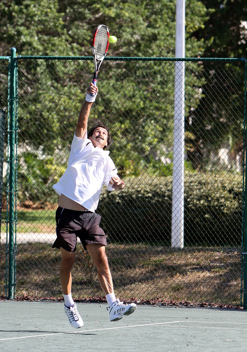 Tim Fitzpatrick jumps up to get the ball.