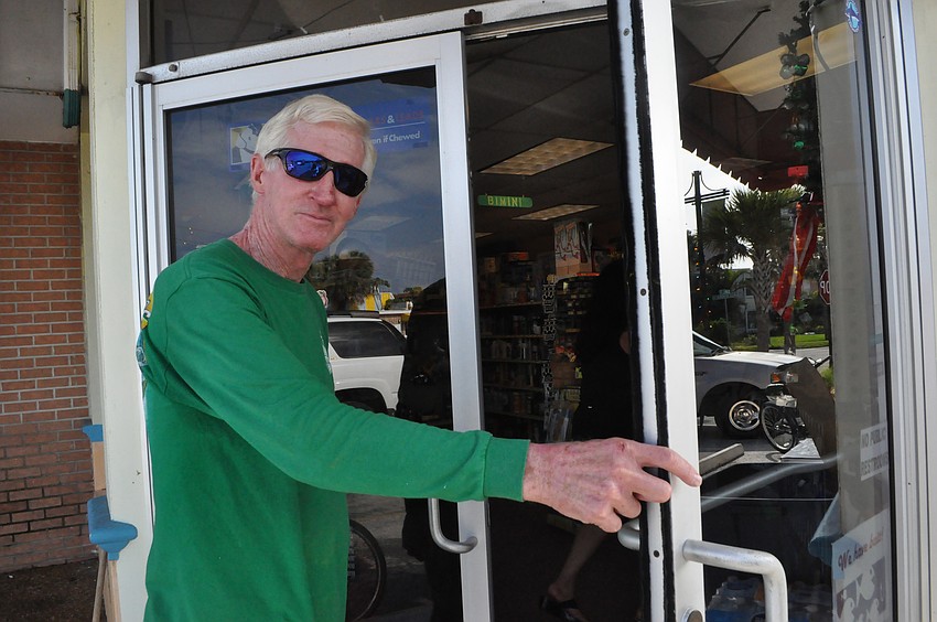 Charlie Davis rides his bike to the hardware store.