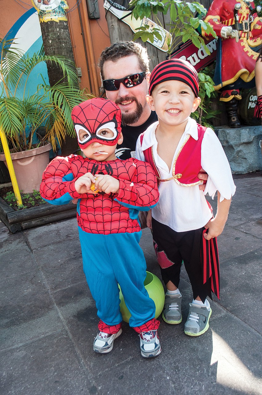 Mike Ryan takes his sons Rocco and Jr. trick-or-treating, Oct. 31, in Siesta Key Village.