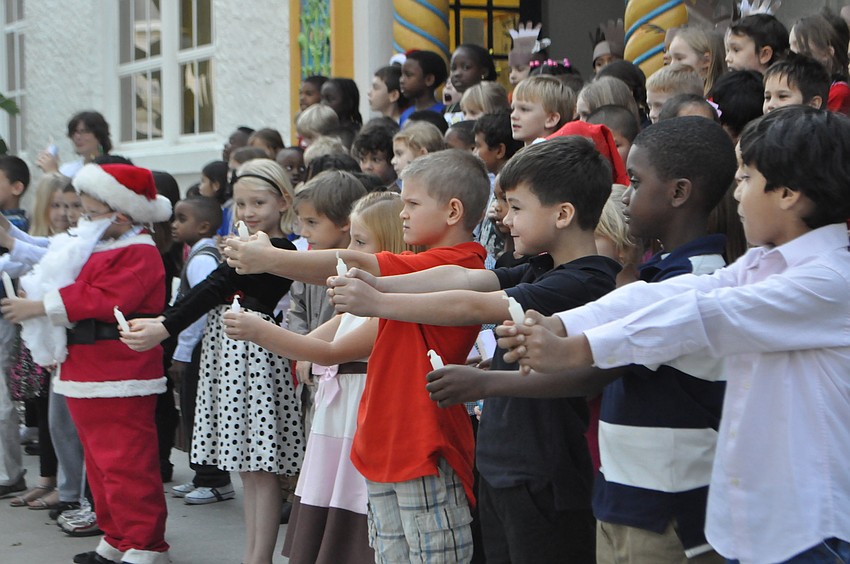 All six first grade classes sing a song in unison.