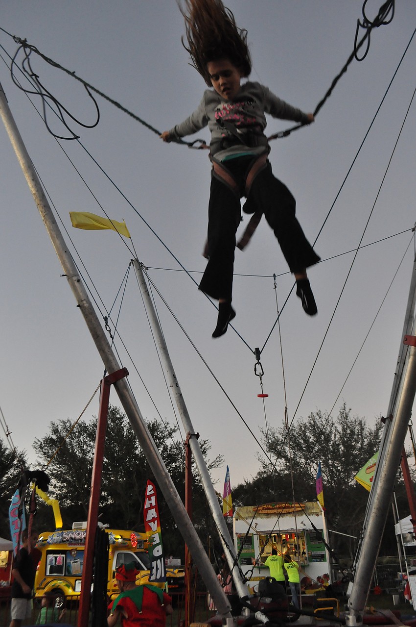 Megan Johnson, 7, flips and bounces at the Sarasota Snow Fest.