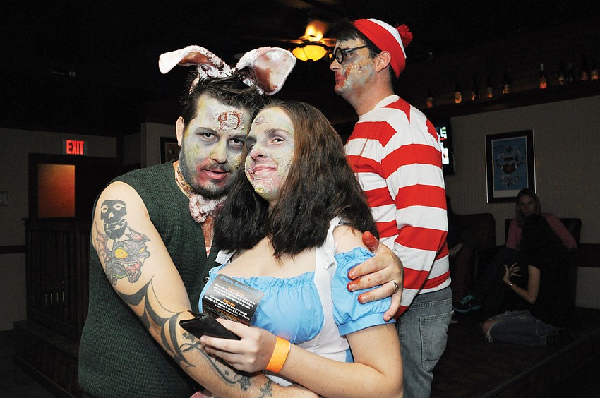 Charles and Danielle Cramblitz and Where's Waldo zombie Greg Werner took part in the annual Gulf Gate Zombie Pub Crawl.